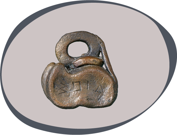 Ankle-shaped bronze weight with engraved inscription “ΔΙΟΣ” (for Zeus)